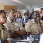 Adult,  Bracelet,  Cup,  Male,  Man,  Officer,  Pen,  Person,  Tie,  Wristwatch